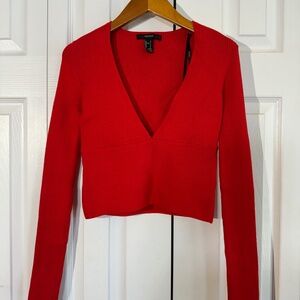 Cropped red long-sleeve top